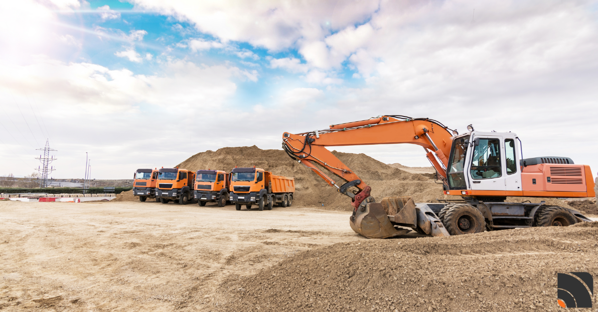 Engins de chantier oranges en activité sur un chantier